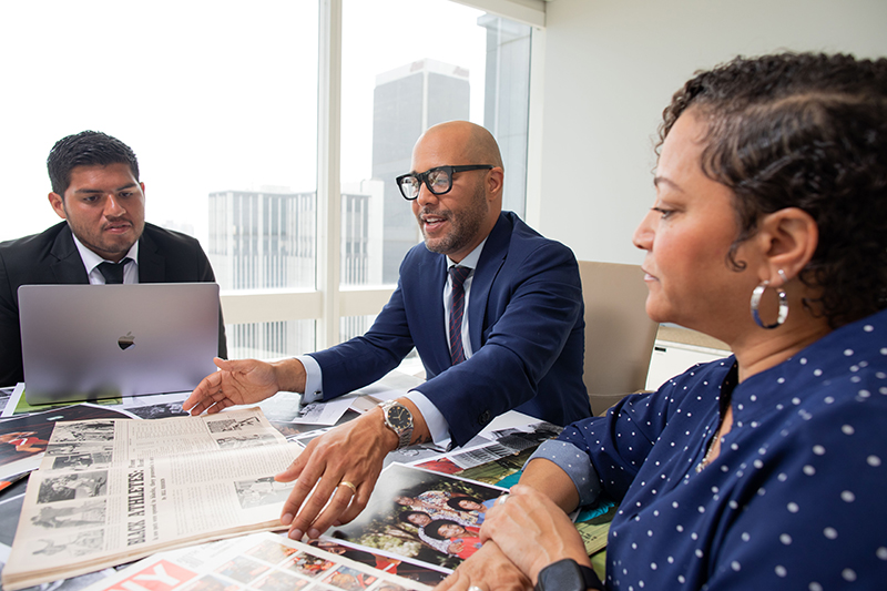 George Fatheree Excitedly Shares Ebony Magazine Issues at Conference Table